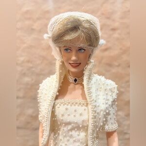 Franklin Mint Princess Diana porcelain doll with accessories in original box.